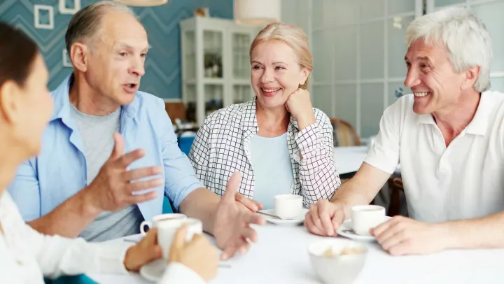 group of elderly people talking with each other